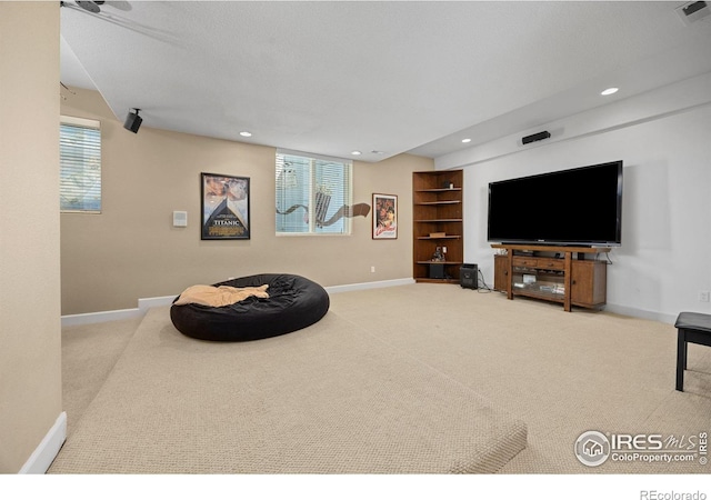13 Blue Heron Dr, Thornton, CO 80241 - carpeted living area featuring baseboards, recessed lighting, and healthy amount of natural light