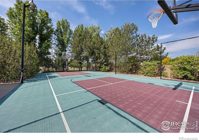 13 Blue Heron Dr, Thornton, CO 80241 - view of basketball court with community basketball court and view of wooded area
