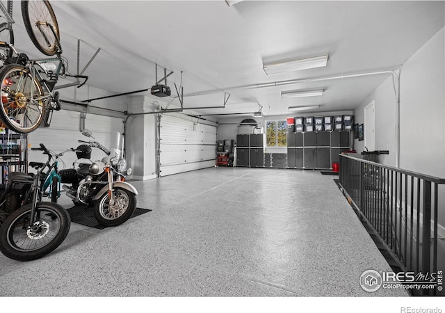 13 Blue Heron Dr, Thornton, CO 80241 - garage featuring a garage door opener