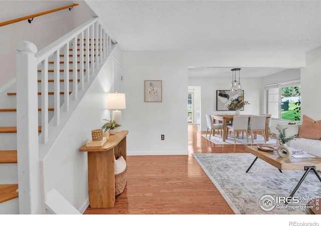 790 W Moorhead Cir # A, Boulder, CO 80305 - living area featuring stairway, light wood-style floors, and baseboards