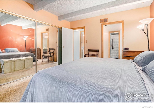 2525 S Dayton Way Unit 2301, Denver, CO 80231 - carpeted bedroom with a closet and a textured ceiling