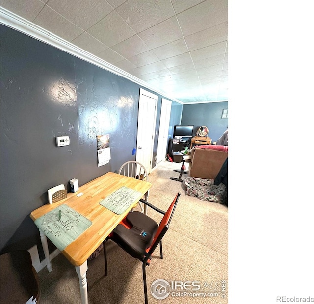 522 K Ave, Limon, CO 80828 - dining space with carpet floors and crown molding