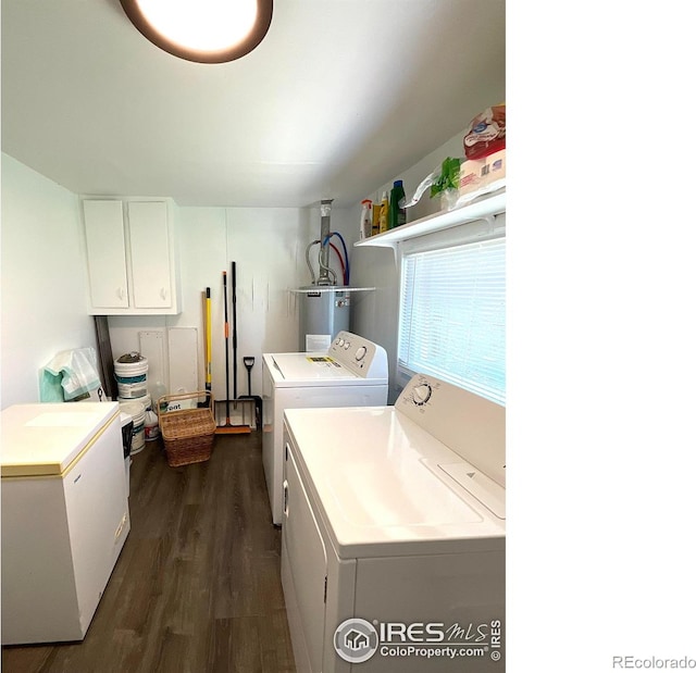 522 K Ave, Limon, CO 80828 - laundry area featuring independent washer and dryer, cabinet space, dark wood-type flooring, and water heater