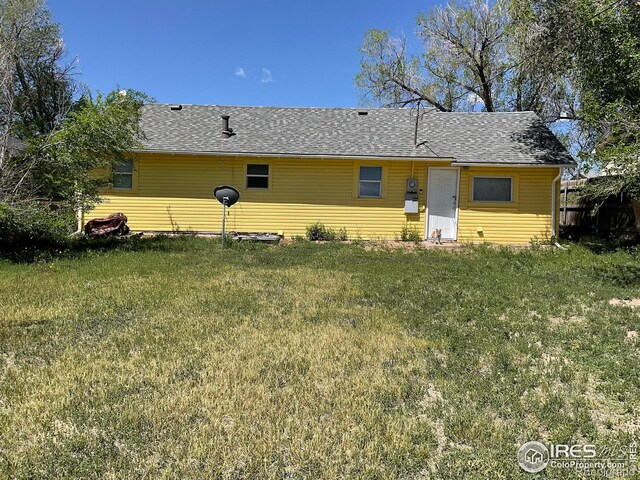 522 K Ave, Limon, CO 80828 - back of property with a lawn and roof with shingles