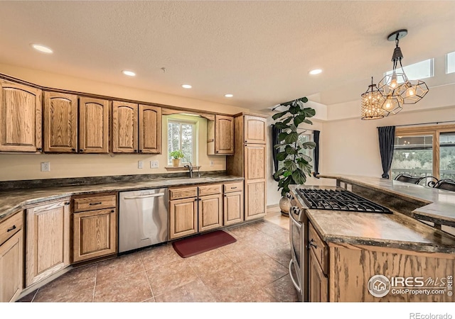 613 Ranch Rd, Ward, CO 80481 - kitchen featuring stainless steel appliances, a sink, dark countertops, a chandelier, and recessed lighting