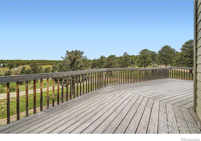 613 Ranch Rd, Ward, CO 80481 - wooden terrace featuring a forest view