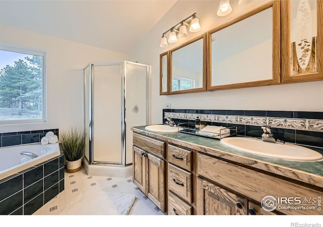 613 Ranch Rd, Ward, CO 80481 - bathroom with a shower stall, double vanity, a garden tub, and tile patterned floors