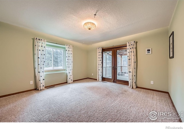 613 Ranch Rd, Ward, CO 80481 - spare room featuring carpet floors, a textured ceiling, and baseboards
