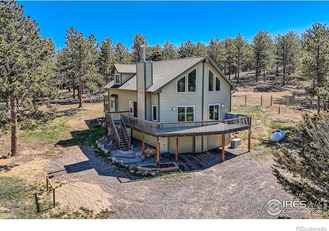 613 Ranch Rd, Ward, CO 80481 - back of house with a wooden deck, central air condition unit, a chimney, and stairs