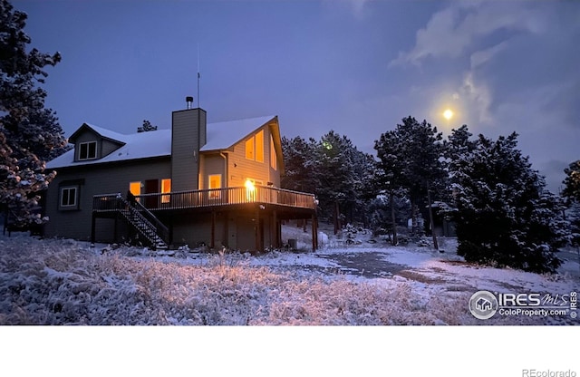 613 Ranch Rd, Ward, CO 80481 - snow covered property featuring a deck, a chimney, and stairway