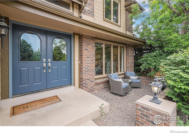 3441 W Dartmouth Ave, Denver, CO 80236 - entrance to property featuring brick siding and french doors
