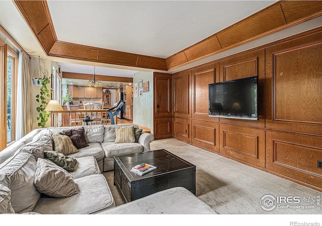 3441 W Dartmouth Ave, Denver, CO 80236 - living room featuring light carpet and wooden walls