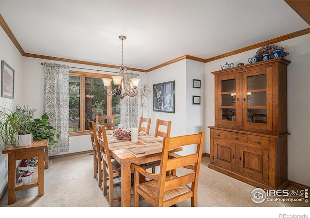 3441 W Dartmouth Ave, Denver, CO 80236 - dining area featuring a chandelier, light colored carpet, baseboards, and crown molding