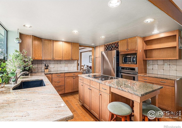 3441 W Dartmouth Ave, Denver, CO 80236 - kitchen with appliances with stainless steel finishes, a sink, tasteful backsplash, open shelves, and a center island
