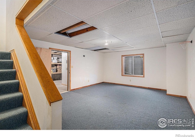 3441 W Dartmouth Ave, Denver, CO 80236 - finished below grade area with stairway, carpet, a drop ceiling, and baseboards