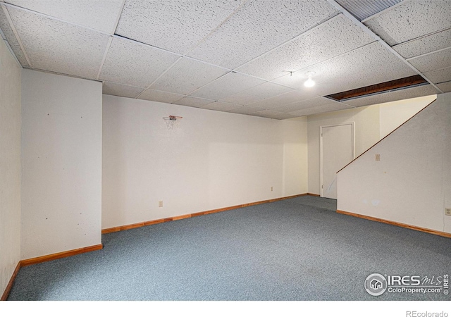 3441 W Dartmouth Ave, Denver, CO 80236 - finished below grade area with carpet, baseboards, and a paneled ceiling