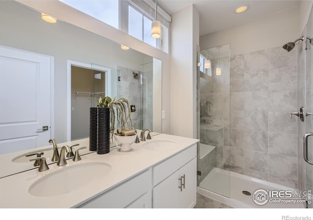 945 Abbott Ln Unit 5, Fort Collins, CO 80524 - bathroom with a stall shower, double vanity, and a walk in closet