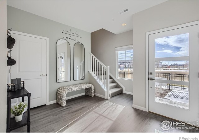 945 Abbott Ln Unit 5, Fort Collins, CO 80524 - entryway with wood finished floors, stairs, baseboards, and recessed lighting