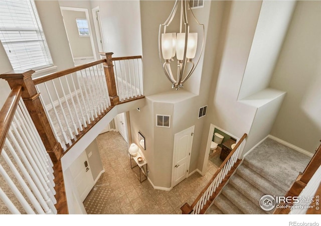 2315 Haymeadow Way, Fort Collins, CO 80525 - stairs with baseboards and a chandelier