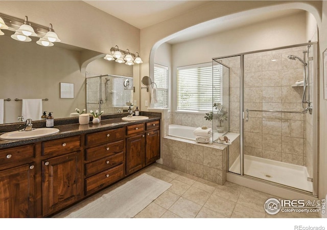 2315 Haymeadow Way, Fort Collins, CO 80525 - bathroom with a stall shower, a bath, tile patterned flooring, and double vanity