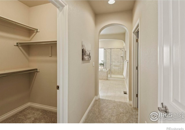 2315 Haymeadow Way, Fort Collins, CO 80525 - spacious closet featuring carpet floors and arched walkways