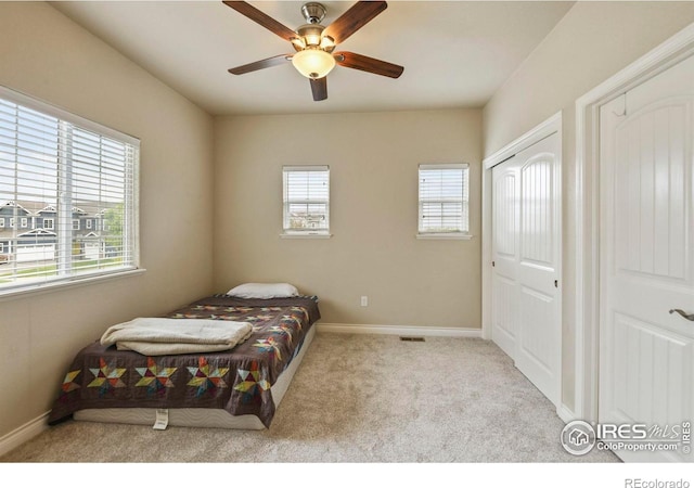 2315 Haymeadow Way, Fort Collins, CO 80525 - carpeted bedroom with baseboards, a ceiling fan, and multiple closets