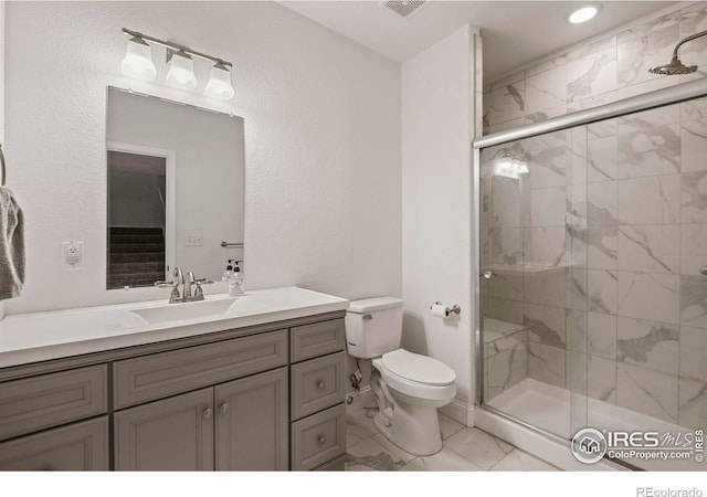 2315 Haymeadow Way, Fort Collins, CO 80525 - bathroom with marble finish floors, toilet, a shower stall, vanity, and recessed lighting