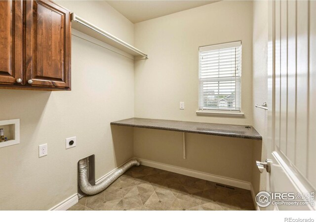 2315 Haymeadow Way, Fort Collins, CO 80525 - laundry room featuring electric dryer hookup, cabinet space, baseboards, and washer hookup