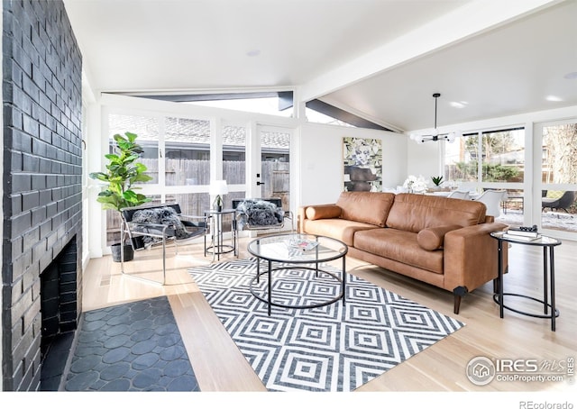 2435 S Meade St, Denver, CO 80219 - living area with wood finished floors and a fireplace