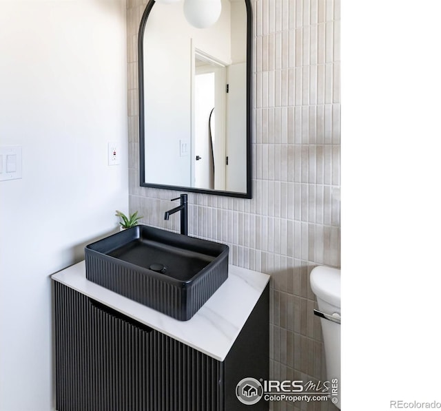 2435 S Meade St, Denver, CO 80219 - bathroom featuring vanity and toilet