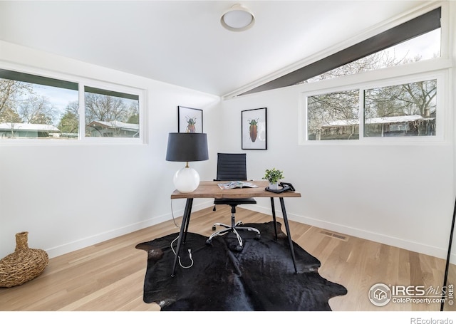 2435 S Meade St, Denver, CO 80219 - office space with vaulted ceiling, plenty of natural light, baseboards, and light wood-type flooring
