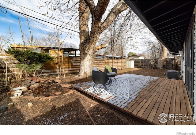 2435 S Meade St, Denver, CO 80219 - deck featuring a fenced backyard and central air condition unit