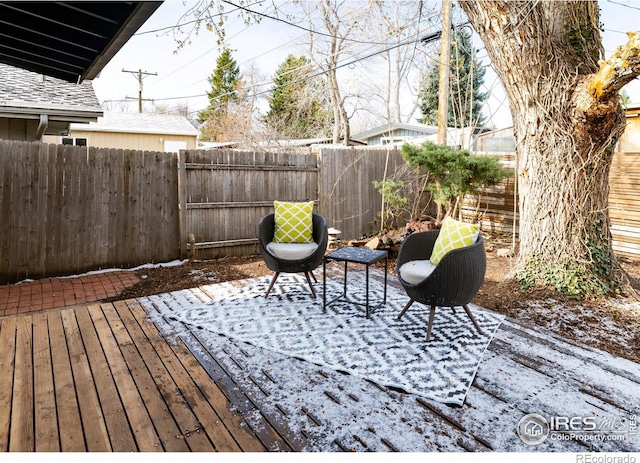2435 S Meade St, Denver, CO 80219 - wooden deck with a fenced backyard and a patio area