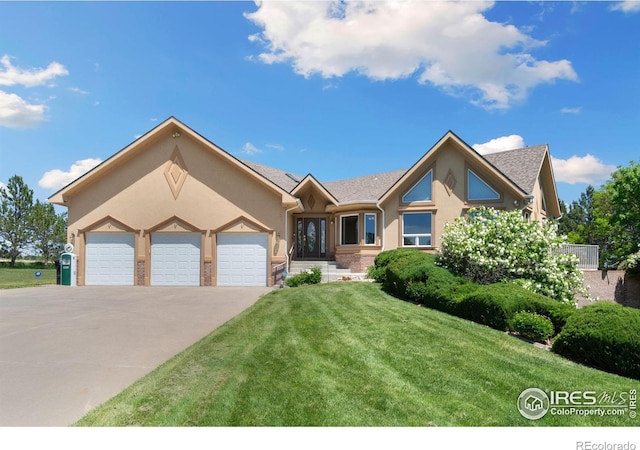 6239 Ashcroft Rd, Greeley, CO 80634 - ranch-style house with a front yard, stucco siding, a garage, and concrete driveway