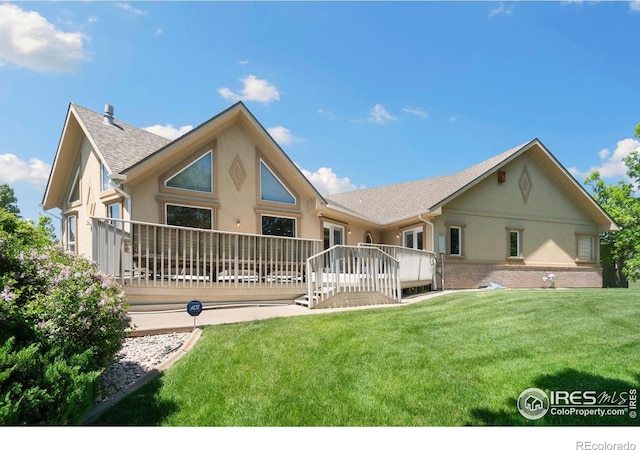 6239 Ashcroft Rd, Greeley, CO 80634 - rear view of property featuring stucco siding, a deck, a lawn, and roof with shingles