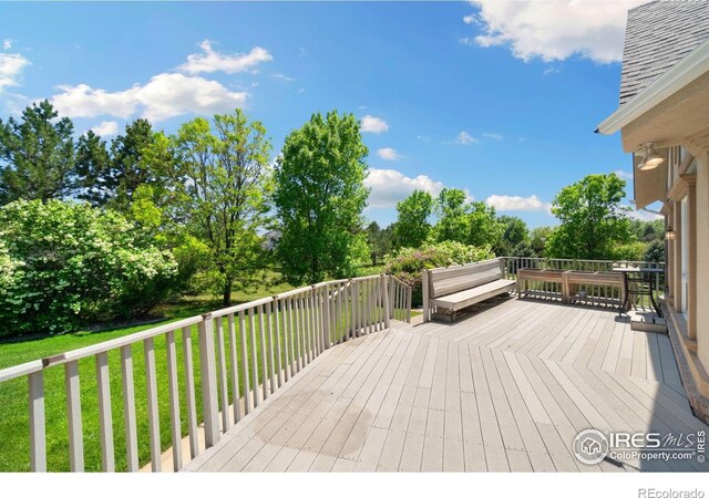 6239 Ashcroft Rd, Greeley, CO 80634 - wooden terrace featuring a lawn