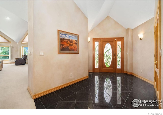 6239 Ashcroft Rd, Greeley, CO 80634 - foyer featuring baseboards, granite tiled floors, and high vaulted ceiling