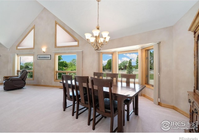 6239 Ashcroft Rd, Greeley, CO 80634 - dining room with a chandelier, light colored carpet, baseboards, and high vaulted ceiling