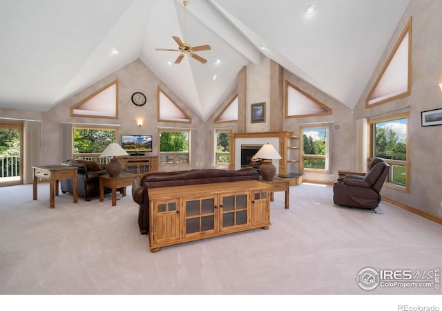 6239 Ashcroft Rd, Greeley, CO 80634 - living area with light colored carpet, high vaulted ceiling, a ceiling fan, a fireplace, and recessed lighting