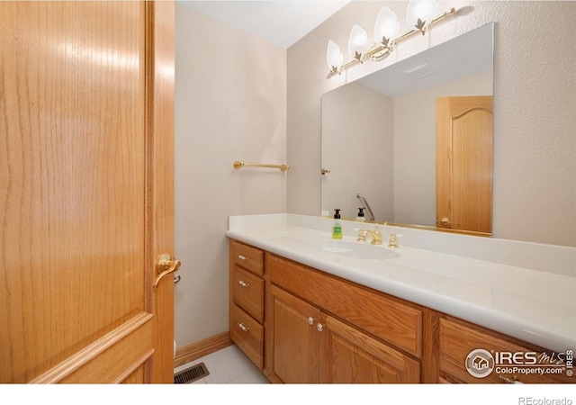 6239 Ashcroft Rd, Greeley, CO 80634 - bathroom with vanity and tile patterned flooring