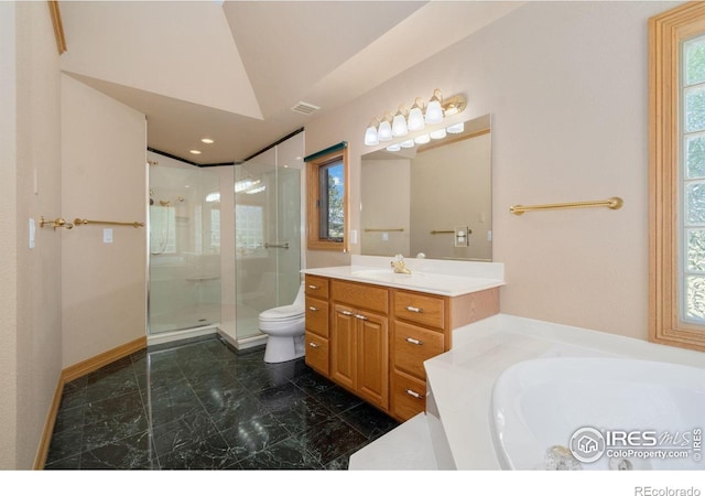 6239 Ashcroft Rd, Greeley, CO 80634 - full bath with a shower stall, marble finish floors, vanity, toilet, and a bath
