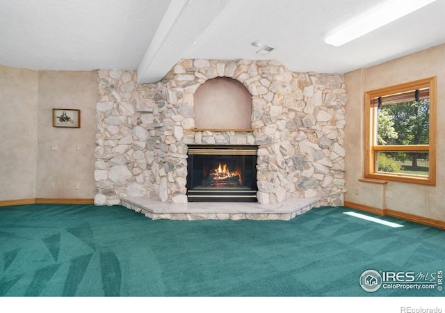 6239 Ashcroft Rd, Greeley, CO 80634 - unfurnished living room with carpet flooring, a fireplace, baseboards, and beamed ceiling