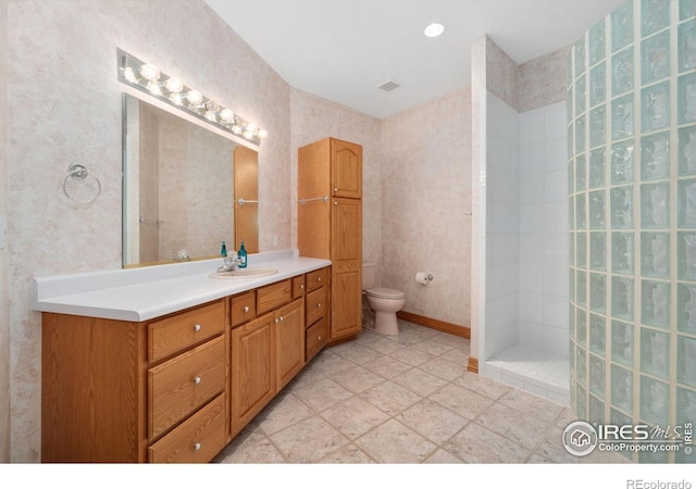 6239 Ashcroft Rd, Greeley, CO 80634 - full bathroom with toilet, vanity, and a walk in shower