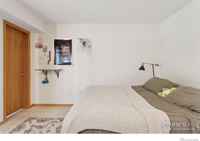 2802 Sundown Ln Unit 102, Boulder, CO 80303 - bedroom featuring wood finished floors and baseboards