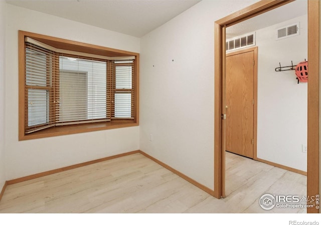 2802 Sundown Ln Unit 102, Boulder, CO 80303 - spare room featuring light wood-style floors and baseboards
