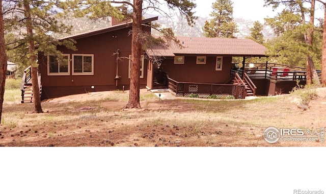 730 Spring St, Estes Park, CO 80517 - view of front of property featuring stairs and a wooden deck