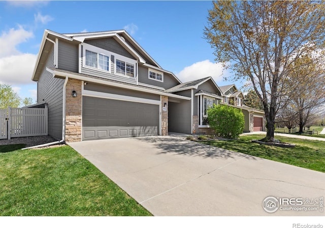 9930 Cascade St, Firestone, CO 80504 - craftsman house with a garage, driveway, and stone siding