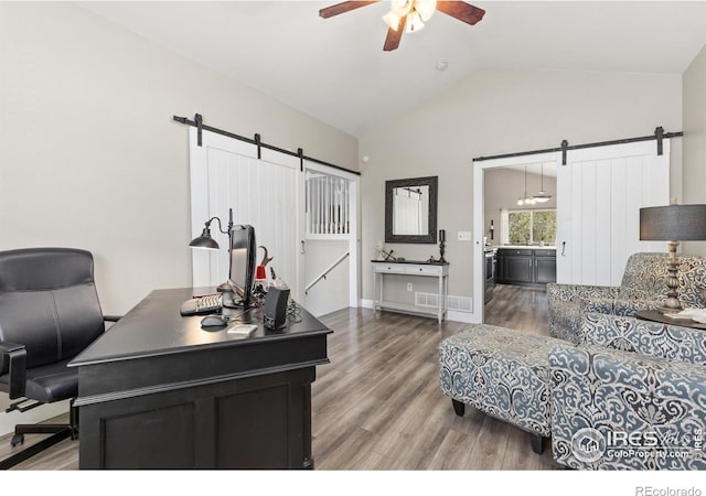 9930 Cascade St, Firestone, CO 80504 - office featuring a barn door, a ceiling fan, light wood-type flooring, and high vaulted ceiling
