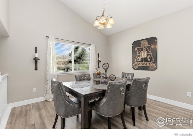 9930 Cascade St, Firestone, CO 80504 - dining area featuring a chandelier, light wood finished floors, baseboards, and high vaulted ceiling