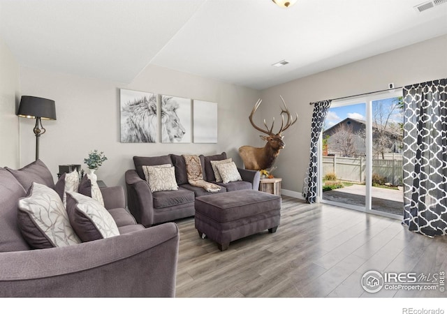 9930 Cascade St, Firestone, CO 80504 - living area with light wood-style floors and baseboards